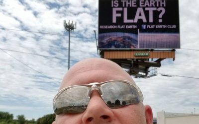 Flat Earth Billboard Image Taken By Man With Bald, Round, Dome Head