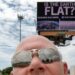 A Flat Earth Billboard Image Taken By A Man With Bald, Round, Dome Head, FEMemes